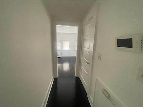 hallway to bedroom and kitchen