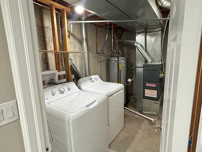 Lower level Laundry room with a new washer and dryer included