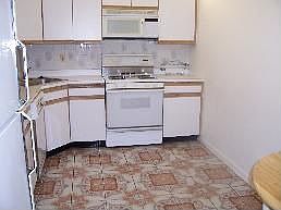 Eat-in Kitchen with Ceramic Tile Floors and Backsplash