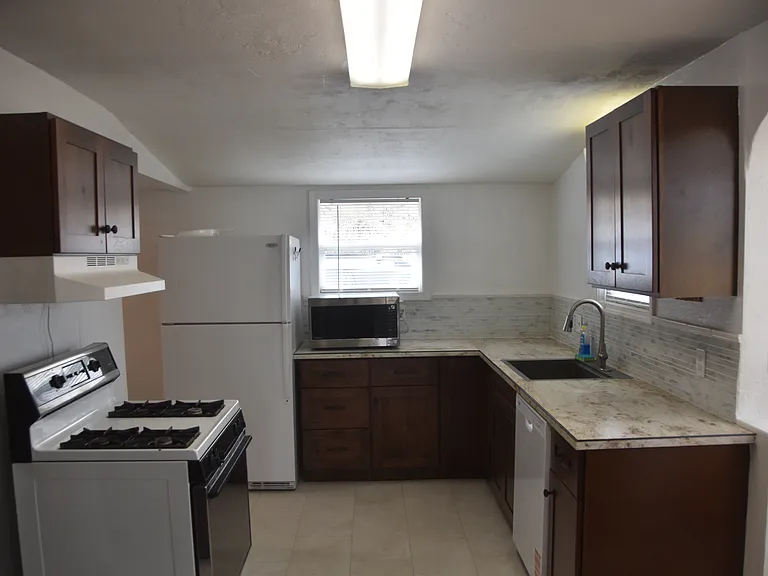 Kitchen looking to Drive Way