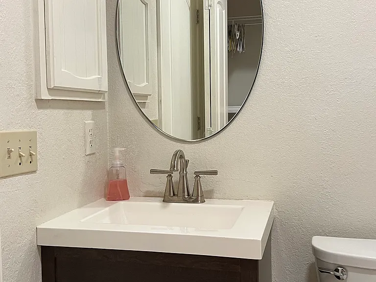 Remodeled bath with new sink and toilet