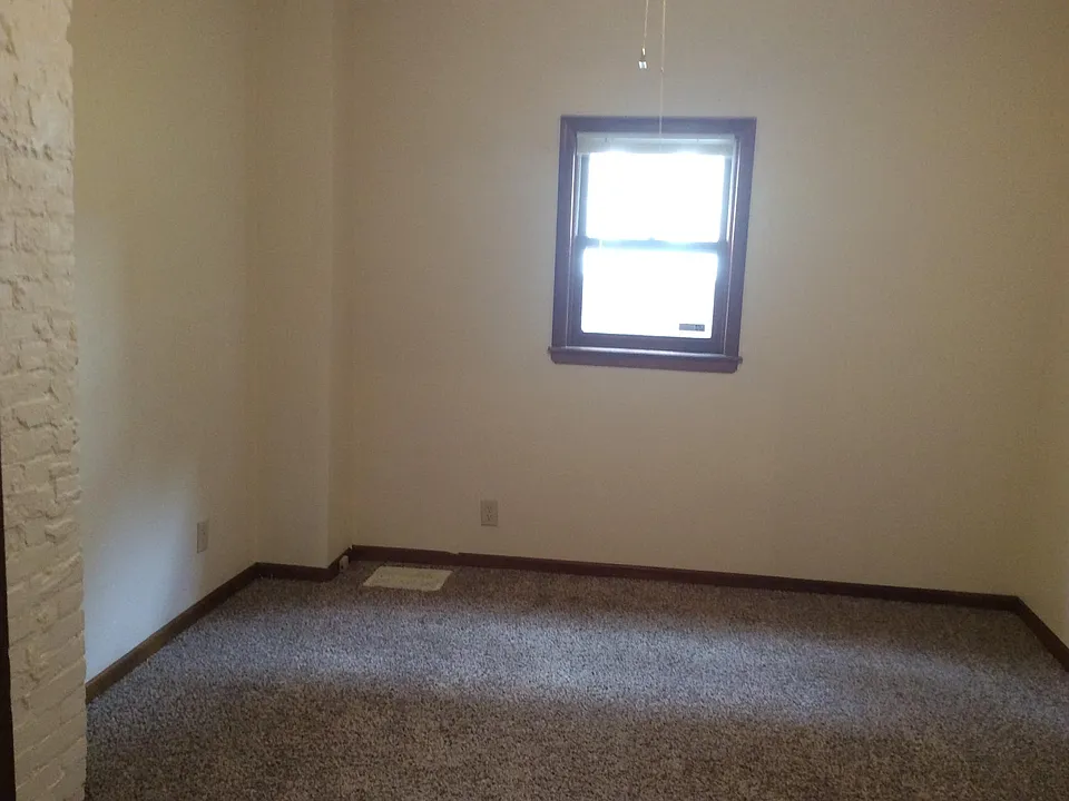 1st Bedroom off Diningroom with new carpet and ceiling fan.