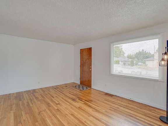 Looking back at front door with big bay window.
