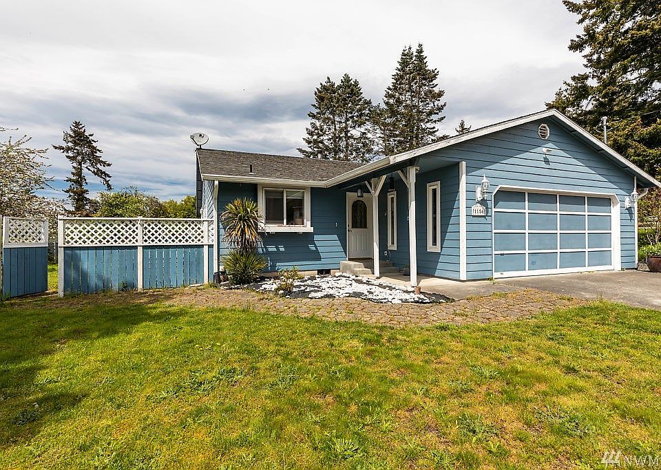 Curb appeal from this cute little rambler on a spacious lot!