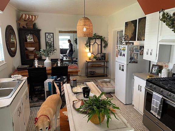 Kitchen has plenty of room for an island to prepare food or use as breakfast area. Gas oven and refrigerator are less than a year old. RockTheRental@gmail.com 337-893-9701