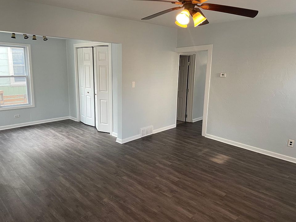Large 1st floor living room, newly painted walls, new vinyl plank flooring, and 1st floor storage closet.