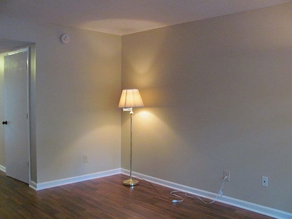 Living room, hard wood floors the door in the picture to the right is a bathroom with washer and dryer