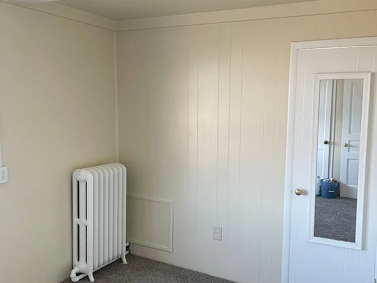 Bedroom, bathroom door to right