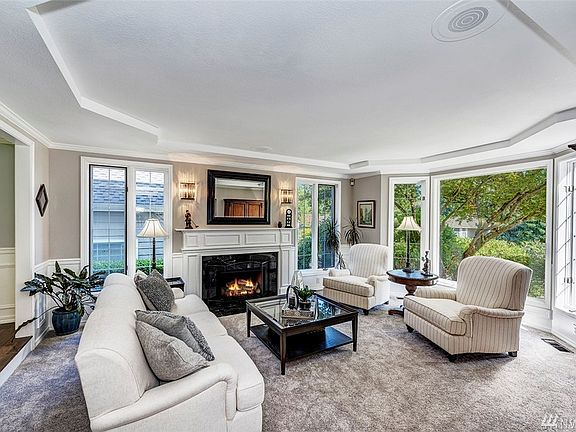 Notice the beautiful millwork and ceiling detail when you gather with a few friends by the fire in the formal living room. 