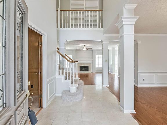 The elegant entry is enhanced with decorative Glass door and Tile Floors allows entry into an amazing floor plan!