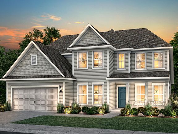 Vanderbilt New Home Exterior 52 with shake accents a front porch.