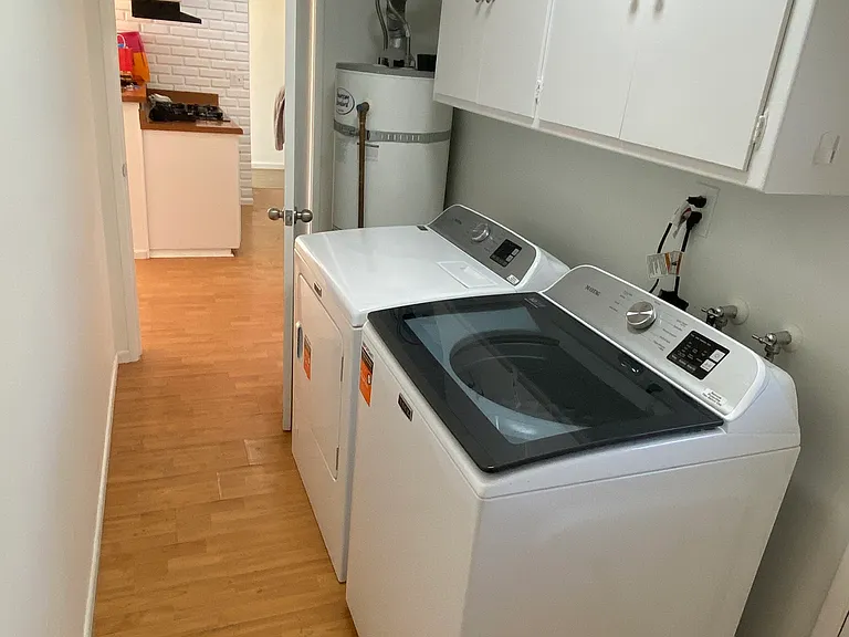 Laundry room with new Maytag washer and dryer.