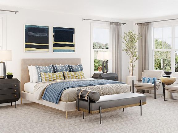 Luxurious primary bedroom suite with two large walk-in closets