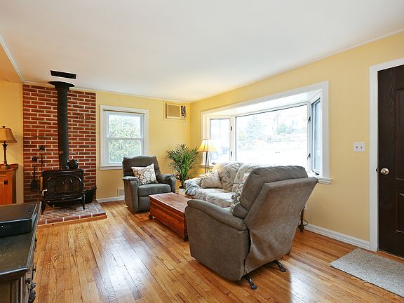 Living Room w/wood burning stove - bow window