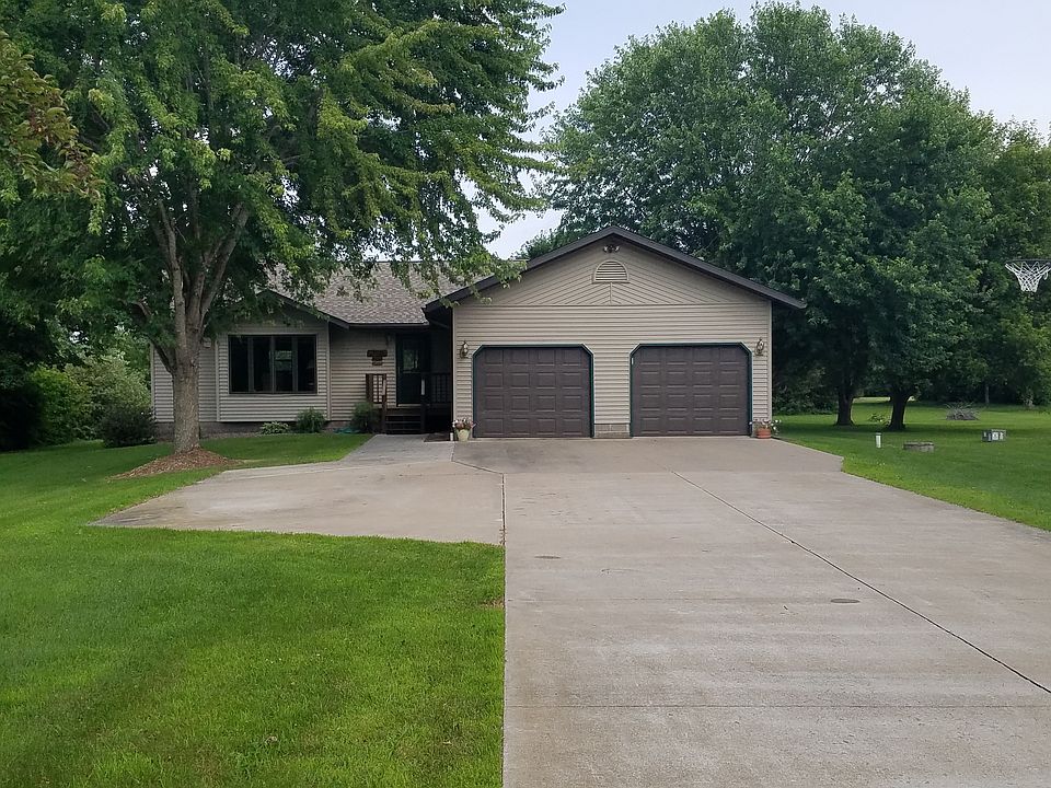 Front of house. Concrete driveway