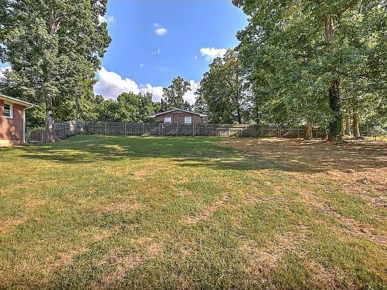 Large fenced backyard.