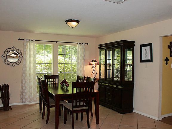 The formal dining area is open to the den, offering lots of opportunities for furniture arrangement.