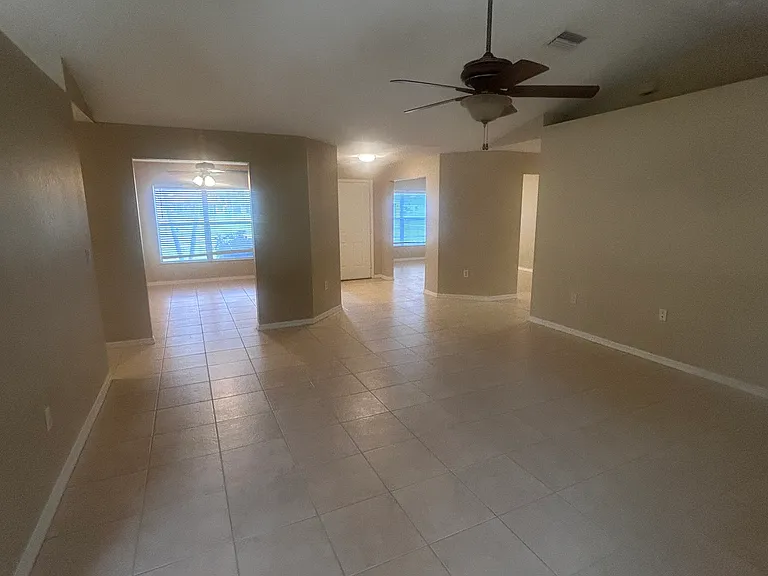 View of living room, 2 bonus rooms front of home and front door