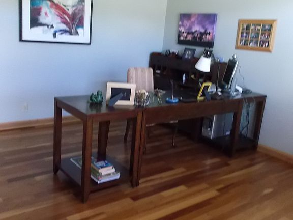 Cathedral ceilings in study, warm cherry floors