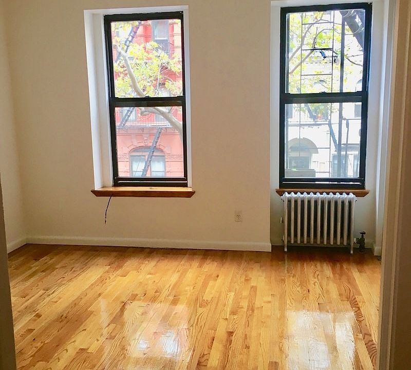 1st image of 100 E 7th St APT 1A