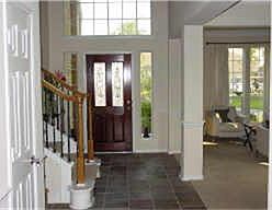    Step into this home through lead-stained glass door and slate floors.  Very open floorplan with designer arch niches and high ceilings.