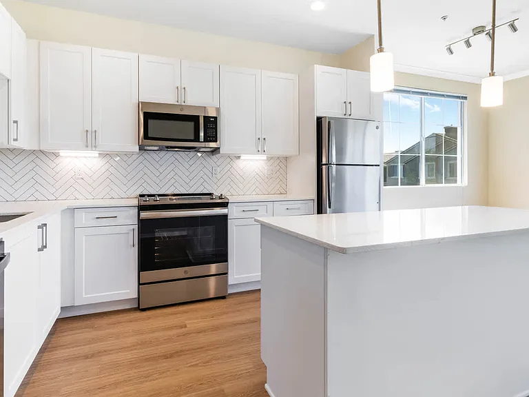 Kitchen with Quartz Countertops and Stainless Steel Appliances