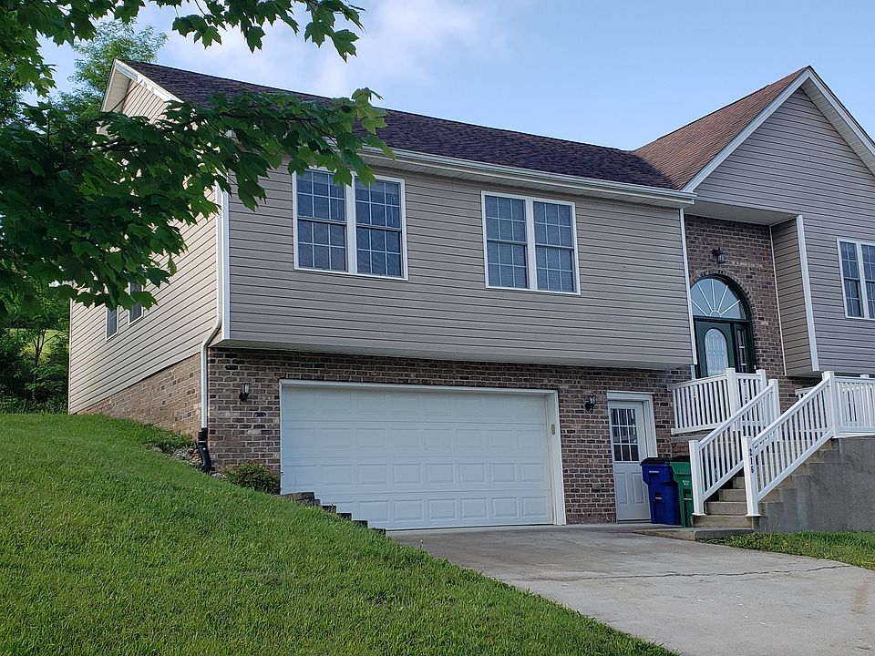 Ample driveway and convenient front and garage entry doors