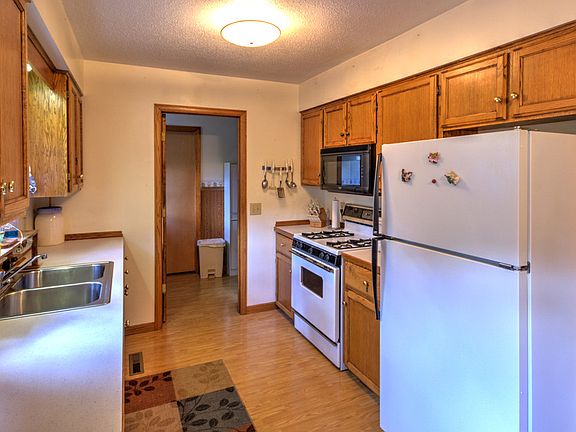 Plenty of oak cabinets and counter space for cooking hearty meals plus a main floor laundry just outside this doorway and a half bath.  