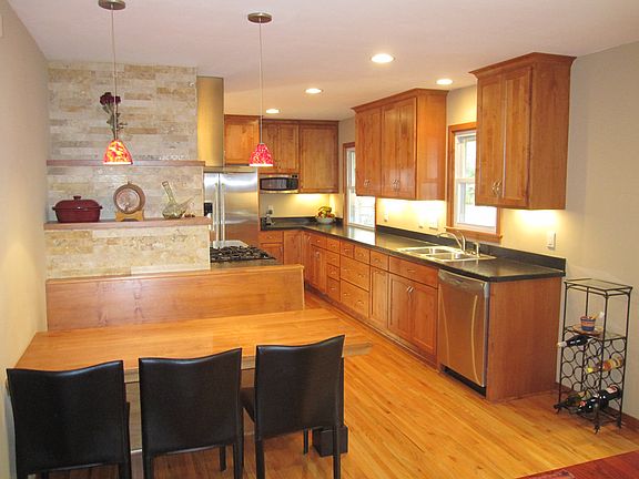 Refinished kitchen with built in table and bench