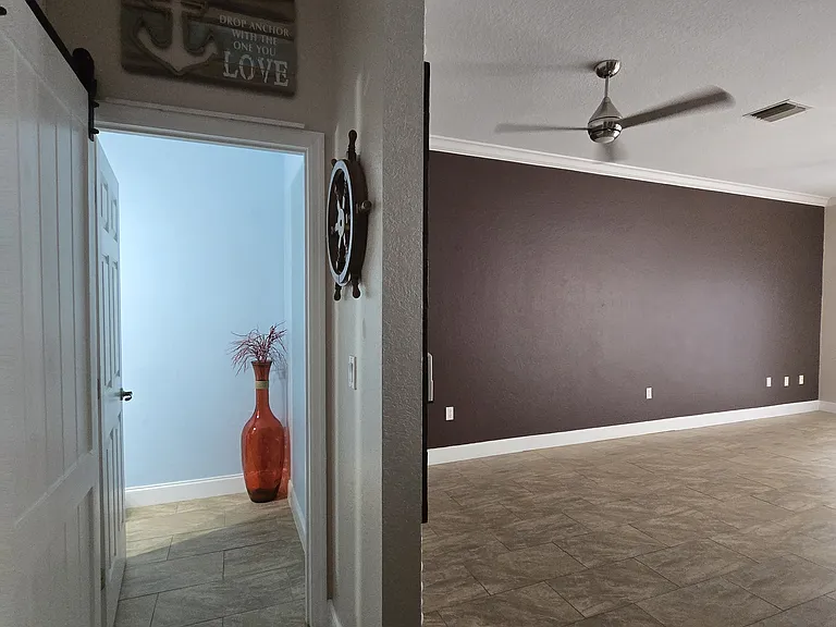 Half bathroom entrance (on left). Living room on right.