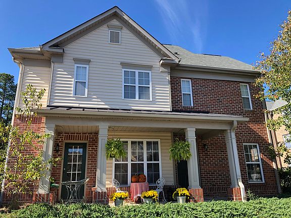 Front view of the townhouse (covered front porch and two entrances)