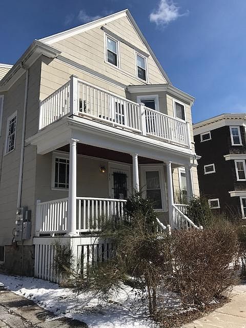 Front of house - balcony on second floor for Unit 2 use