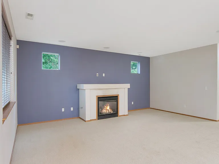 Living room with gas fireplace wired for 5channel sound