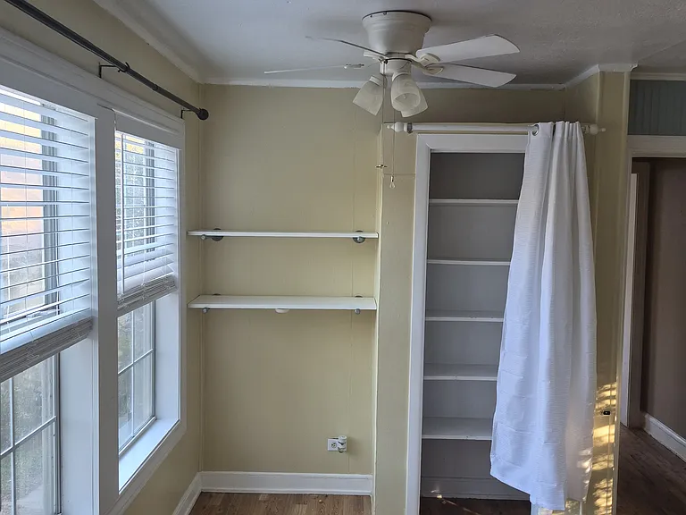 Dining area from Kitchen with pantry open.