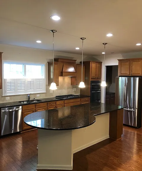 Kitchen Island with Granite Countertops & Stainless Steel Appliances