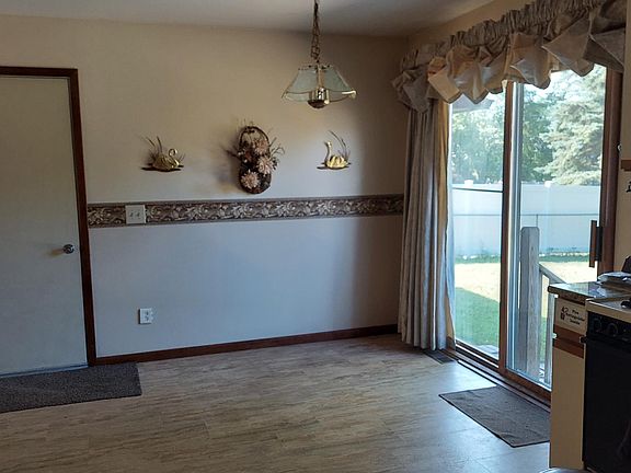 Dining Room with patio door to backyard and door to garage.