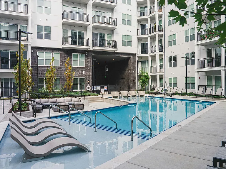 Dive into luxury at our resort-style pool with in-pool seating, where relaxation meets sophistication