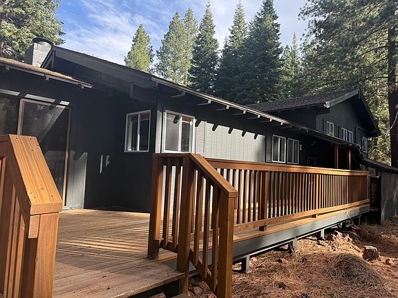 Backside of home with large deck