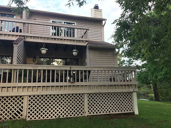 Back of house with 2 decks