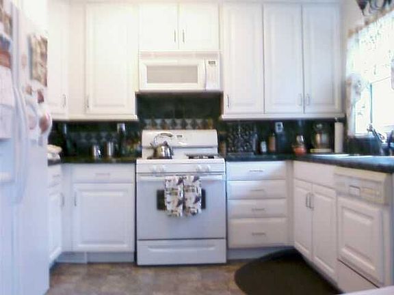 Updated kitchen w/italian tile counters.