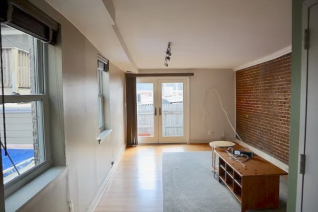 living room, door to private deck