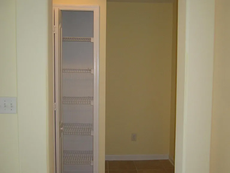 Small hall closet between 2nd and 3rd bedrooms