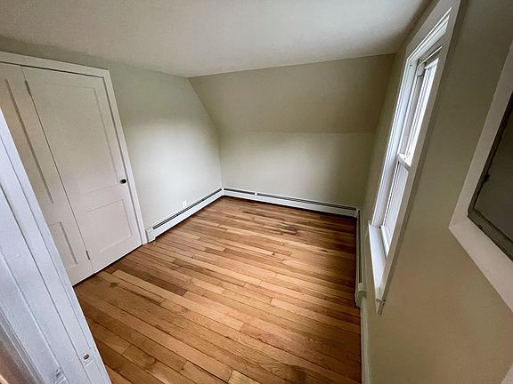 Bedroom. Window overlooks the side yard and back of house.