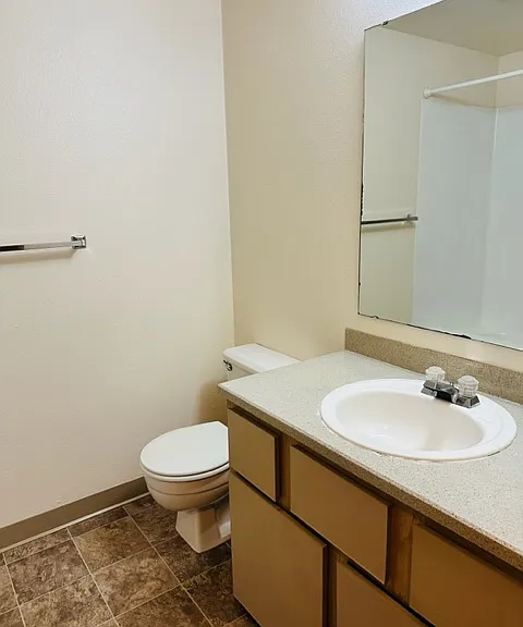 Spacious bathroom in unit with original finishes