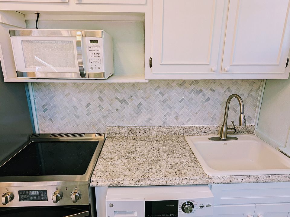 Marble tile backsplash complements the stainless steel 11.5 cu. ft Fridge and electric glass top range, complete with airfryer!
Brand New All in One Washer/Dryer means no hassling with changing over the load, just set it and forget it!