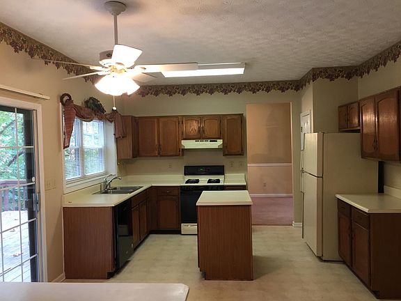 Kitchen and eat-in area with sliding glass doors to over-sized deck