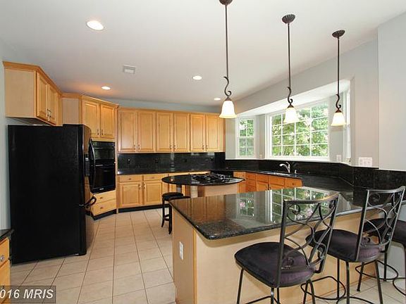 Expansive Kitchen with Granite Counter Tops