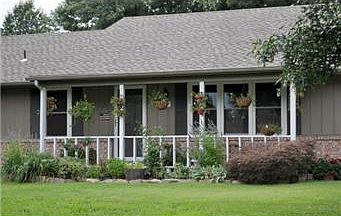 Great Curb Appeal with the Charming Porch & Brick Accents