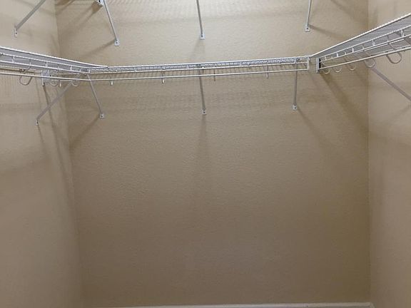 WALK-IN CLOSET IN MASTER BEDROOM