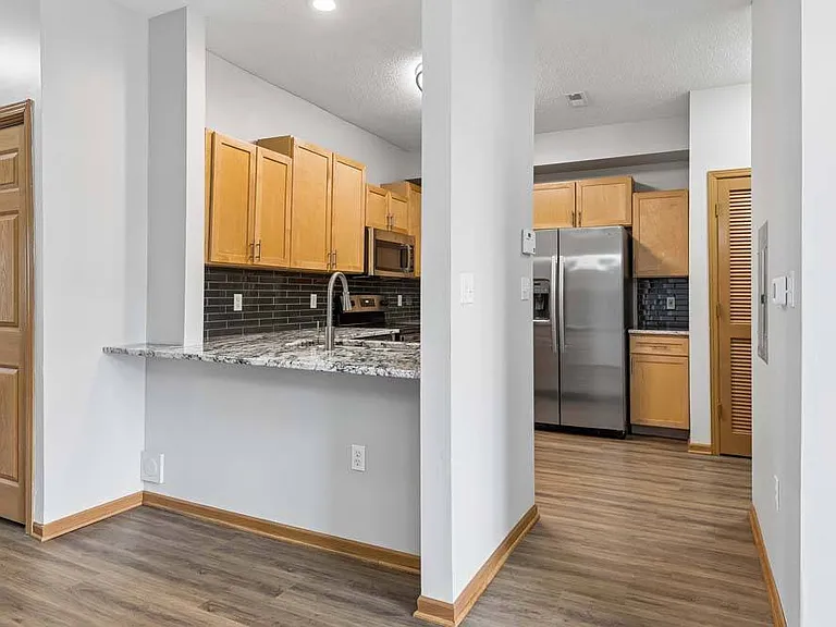An airy layout with a welcoming breakfast bar that makes everyday living feel open and connected.